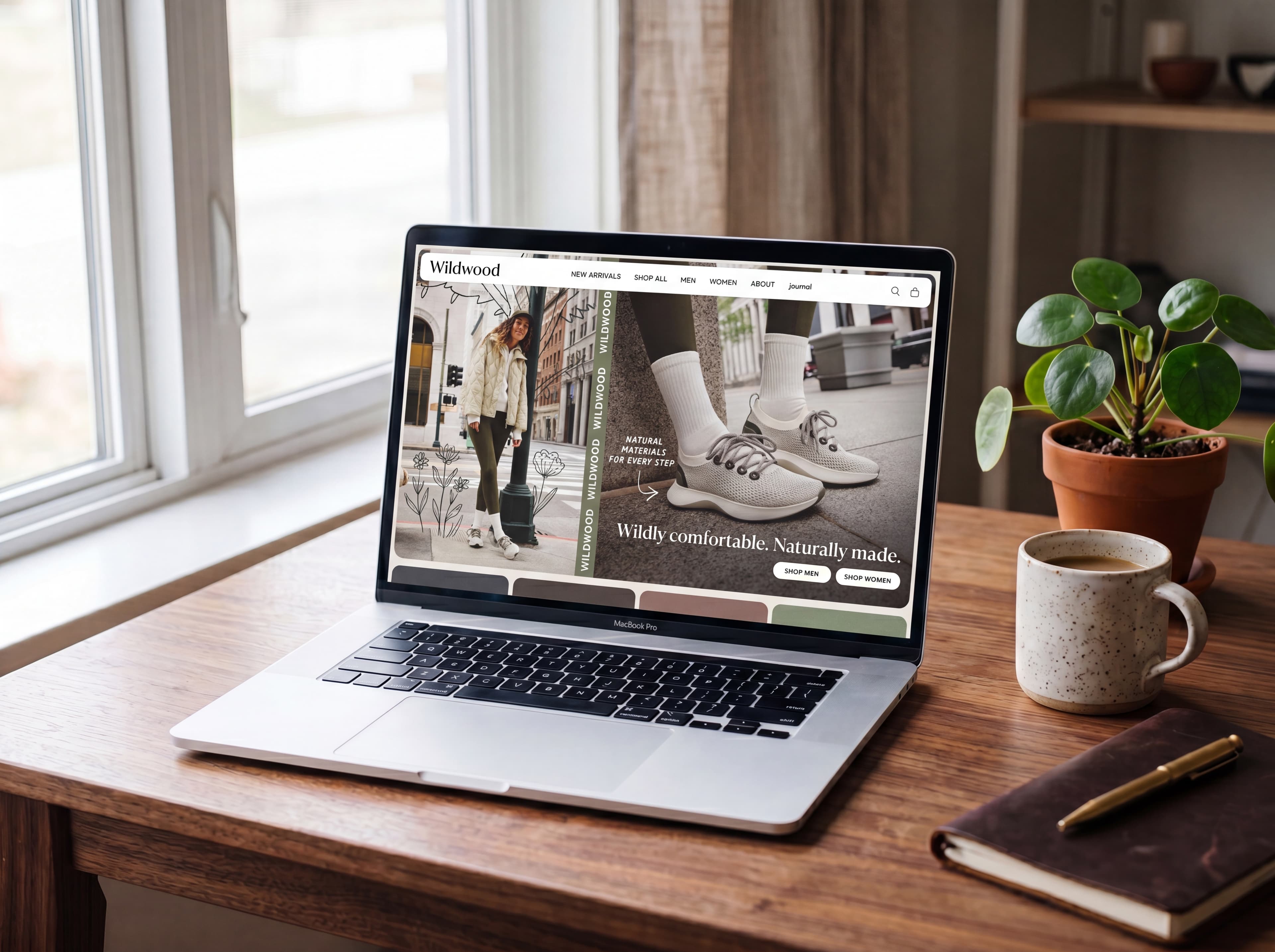 A laptop on a warm wooden desk showing a polished, image-rich small-business retail website